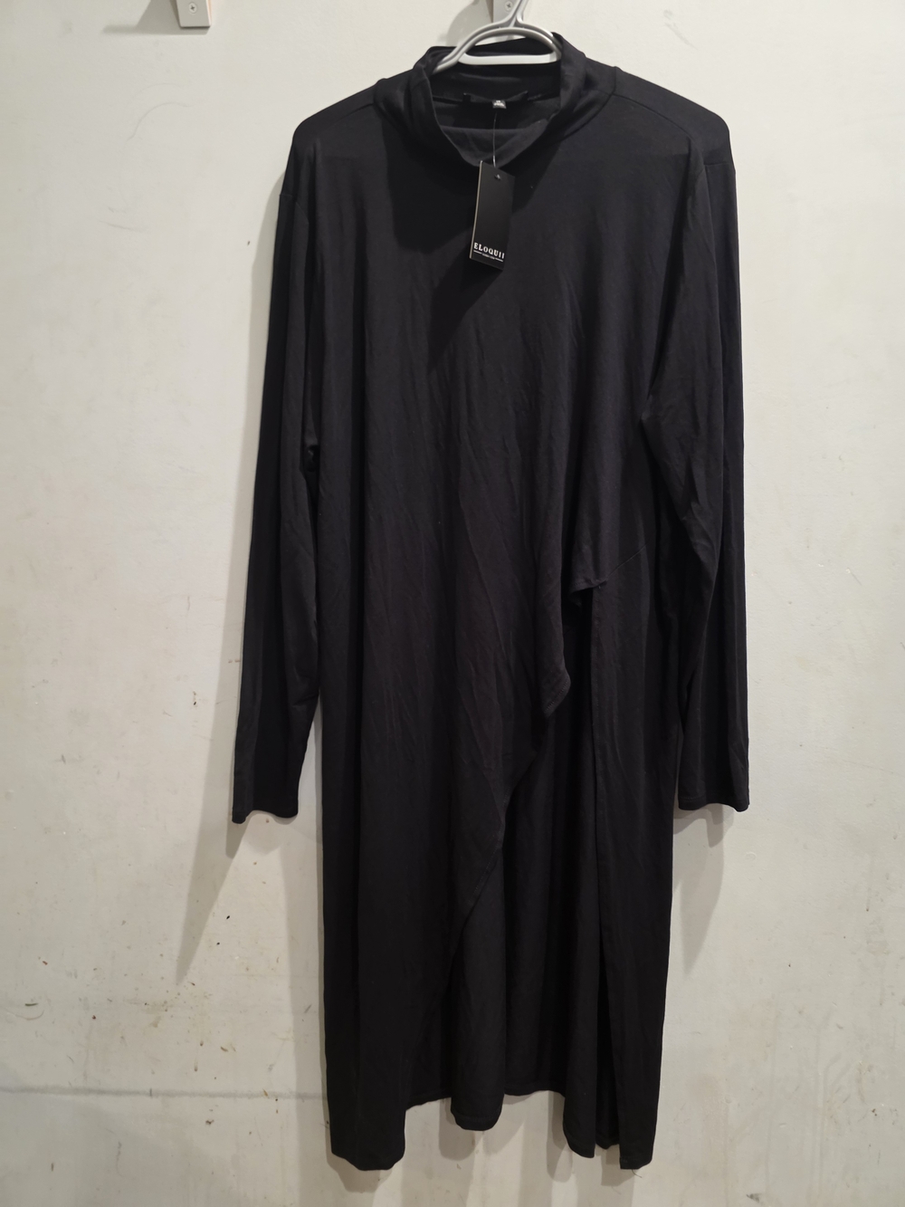 Eloquii dress features an asymmetrical draped panel and a mock neck -